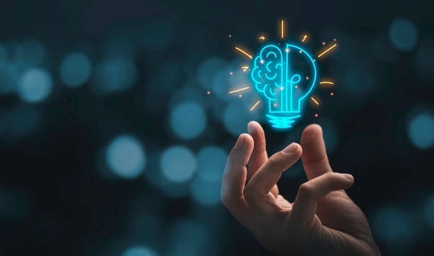 hand holding drawing virtual lightbulb with brain on bokeh background for creative and smart thinking idea concep - 智慧科技 個照片及圖片檔